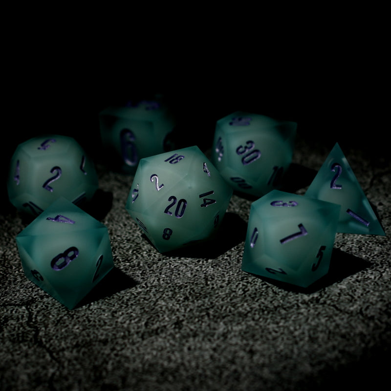 Dark setting. Matte Ice Blue shelled, UV glow White Sphere Core Dice set 