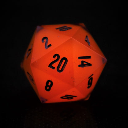 UV/Glow in the Dark Orange cored D20. Inked in purple